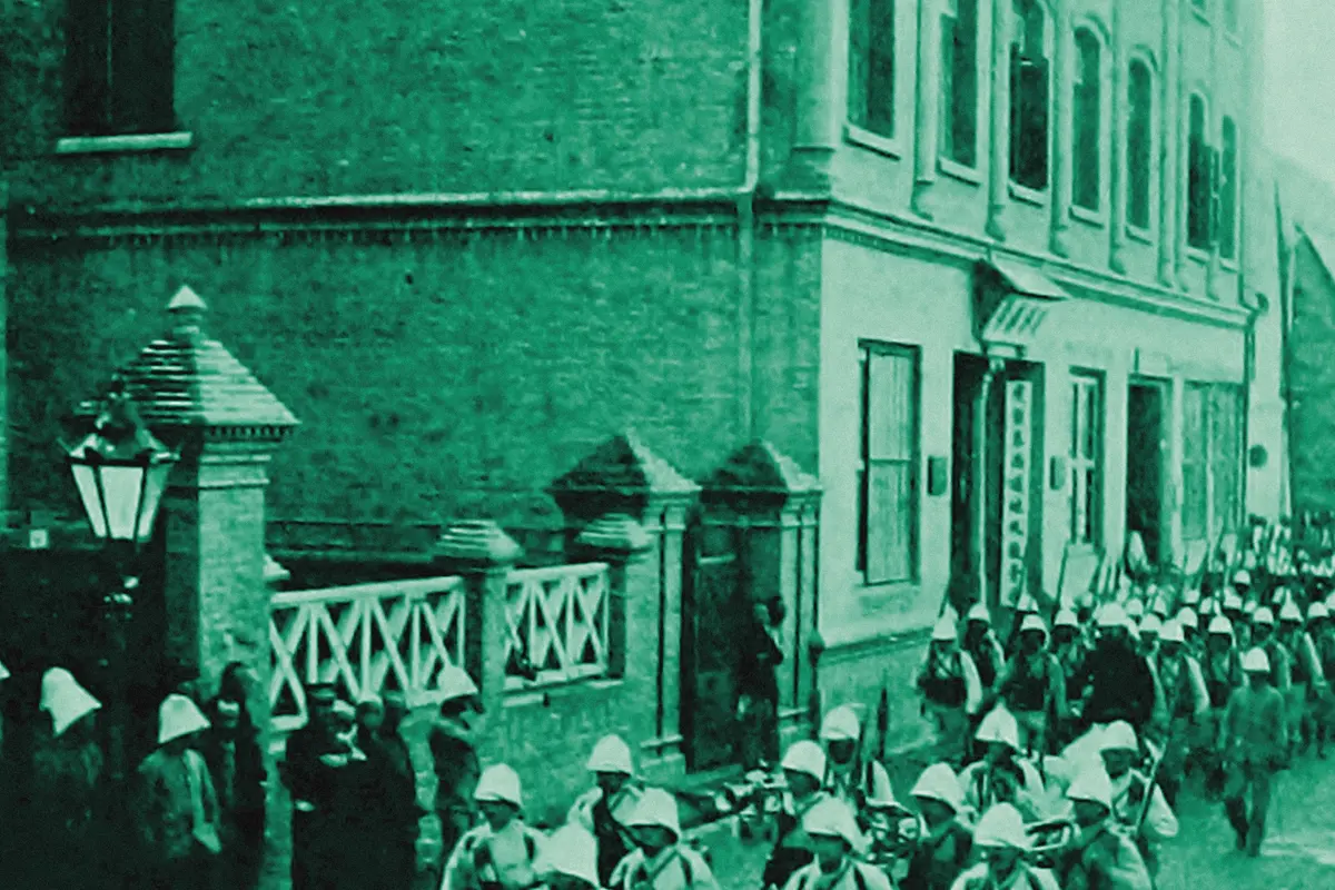 Illustration: French Colonial Infantry Marching through the French Concession, Tientsin, from a period photograph (1903), redrawn as a jade blue pencil duotone.