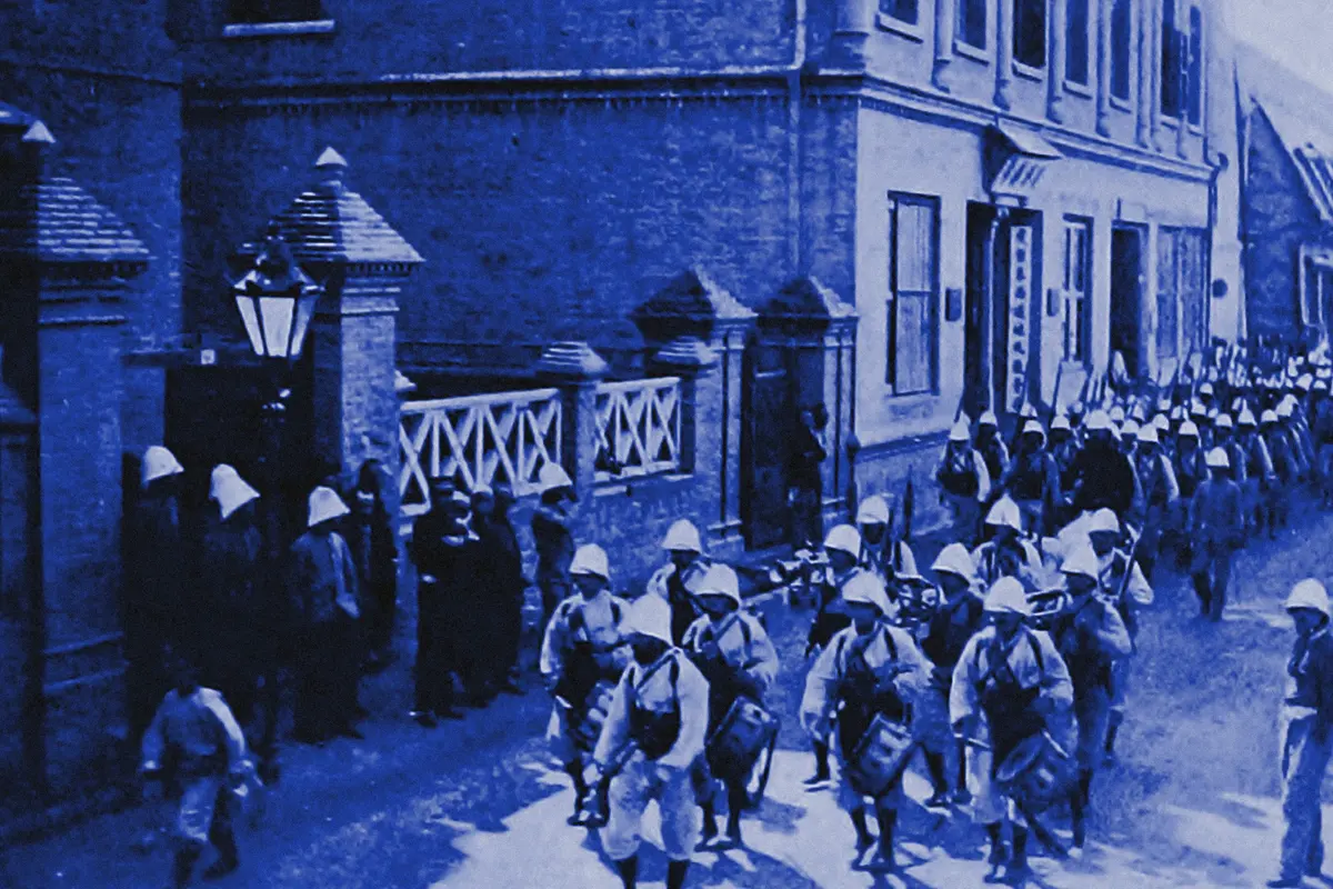 Illustration: French Colonial Infantry Marching through the French Concession, Tientsin, from a period photograph (1903), redrawn as a blue blue pencil duotone.
