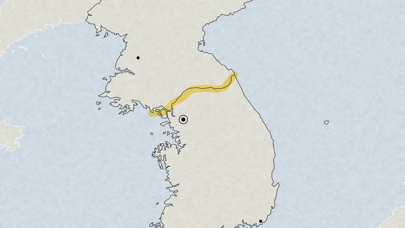 Illustration: a map of the Korean Peninsula with the Military Demarcation Line between North and South Korea marked in yellow highlighter, and Seoul, Pyongyang and Busan.