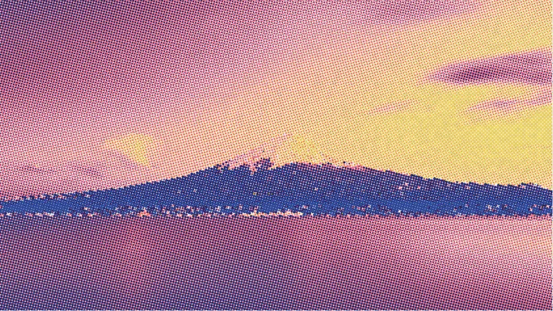 Photo illustration: Mount Fuji above a lake printed as a risograph in blue, pink and yellow.